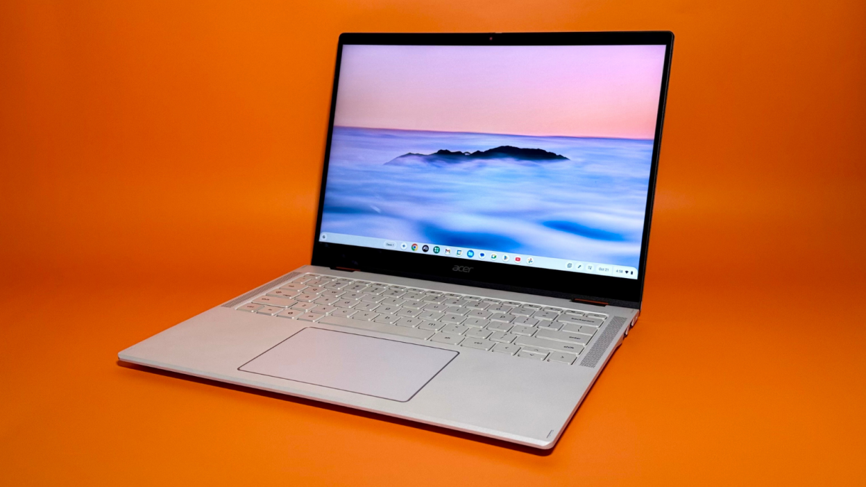 the acer chromebook plus spin 514 against an orange background