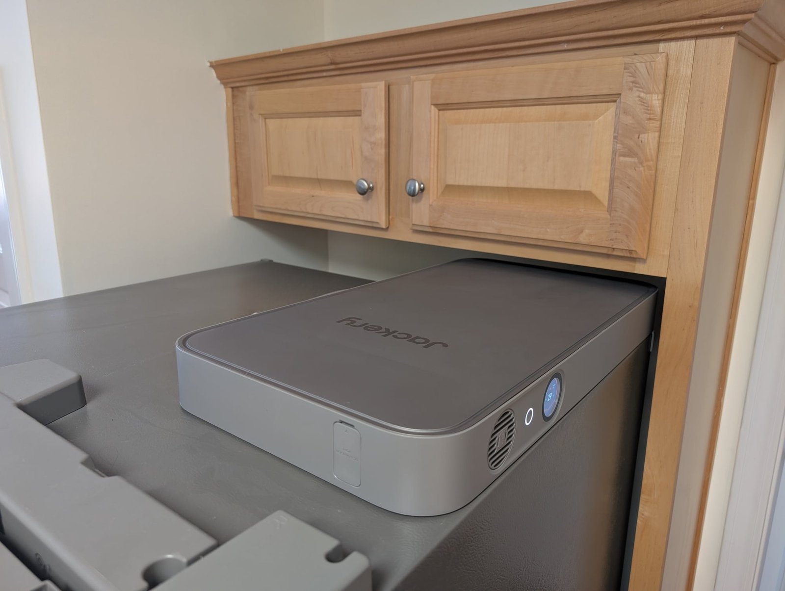 the jackery fridgepower on top of a refrigerator